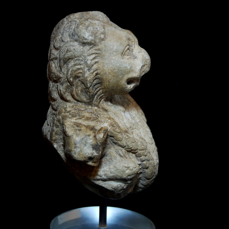 Lion-headed figure (right) from private collection