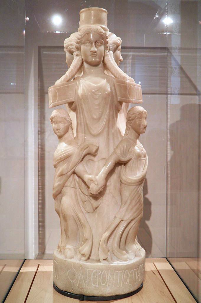 Marble statuette of Hecate depicted as a triple goddess surrounded by dancers