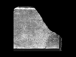 Inscription on restauration of the Mitreo de Carsulae