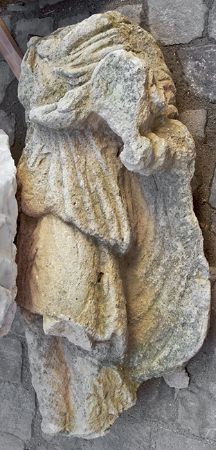 Statue of a torchbearer from Apulum.