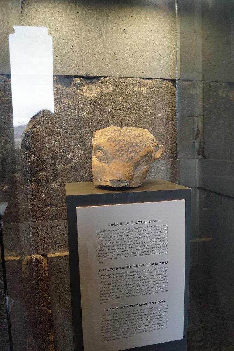 The Bull’s Head from Garni

Now for something more interesting: a relatively new and rarely mentioned artifact - the marble bull’s head from Garni, about which very little information is available. I will refer to the official channel of the Historical Monuments Preservation Service:

[One of the exceptional artifacts held in the collections of the State National Cultural Organization “Service for the Protection of the Historical Environment and Historical-Cultural Museums and Reserves” is a marble bull’s head discovered several years ago in the Garni Gorge.

After Christianity was proclaimed the state religion in Armenia in 301, although the fortresses and defensive complexes remained intact, pagan places of worship were razed to the ground. Only in a few places were some temples adapted to the new religion and rebuilt as Christian sanctuaries.
The Garni Temple is an exception, as it has been preserved in its original form and was used as a secular building. According to the account of Movses Khorenatsi, the “father of Armenian historiography” (presumably born around 410—died in 490), the Garni Temple was converted into the summer residence of Khosrovadukht, the sister of King Trdat III.

Followers of the new religion smashed to pieces and threw into the gorge the marble statue of Mithra, the sun god and bull-fighter, which had been installed in the apse.

Centuries later, during excavations near the temple, a bull’s hoof carved from white marble was discovered, which, according to experts, was part of this sculptural group. Two other fragments—a marble bull’s head and a fragment of the sculptural group’s pedestal—were discovered by chance in 2011 on a steep slope of the gorge.]

Source: [ref:6a9da5cce342f]